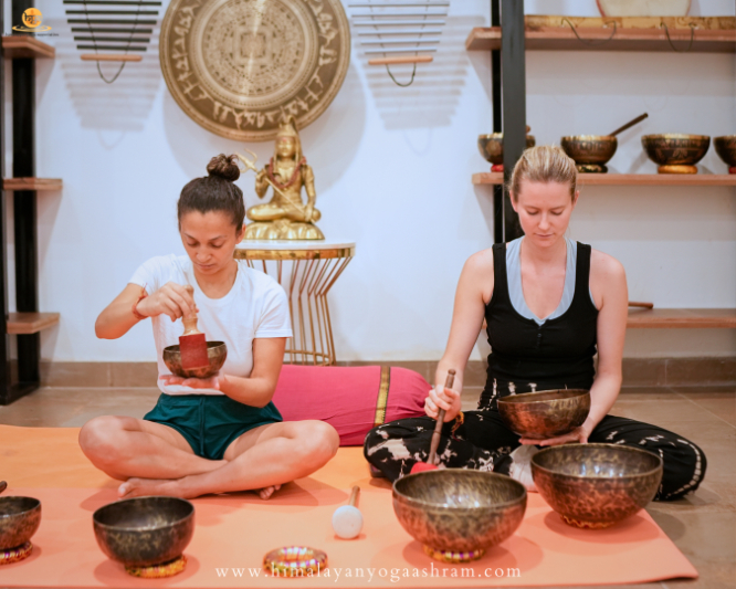 Womens Doing Tibetan singing bowls 