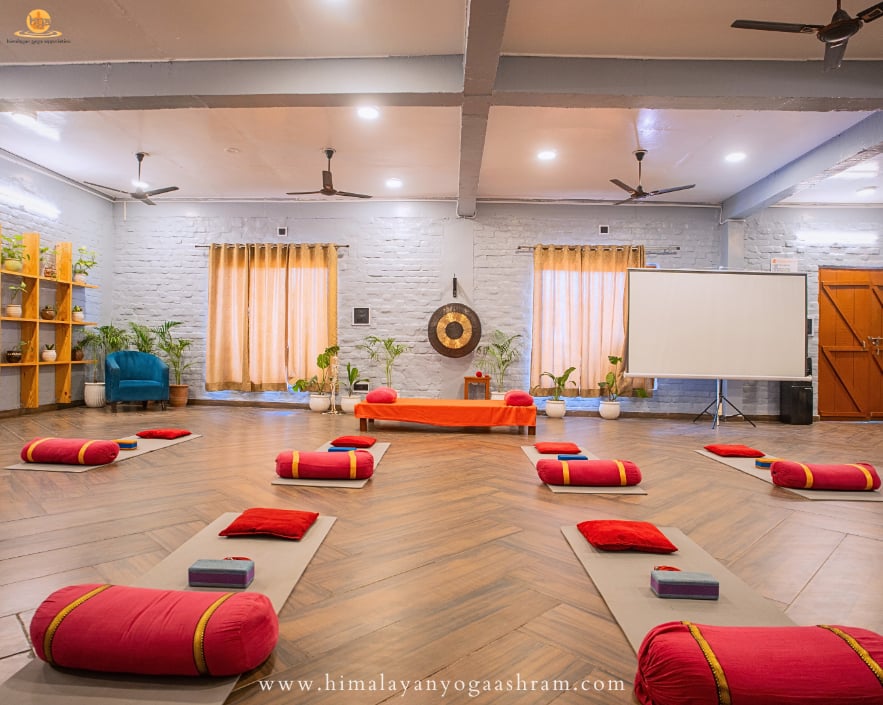 Students practicing yoga in 500 Hours Yoga Hall, Rishikesh