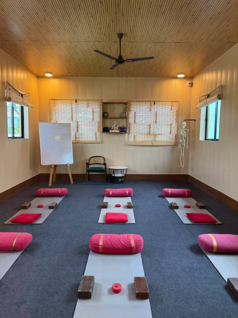 Students practicing Yin Yoga in the teacher training shala in Rishikesh