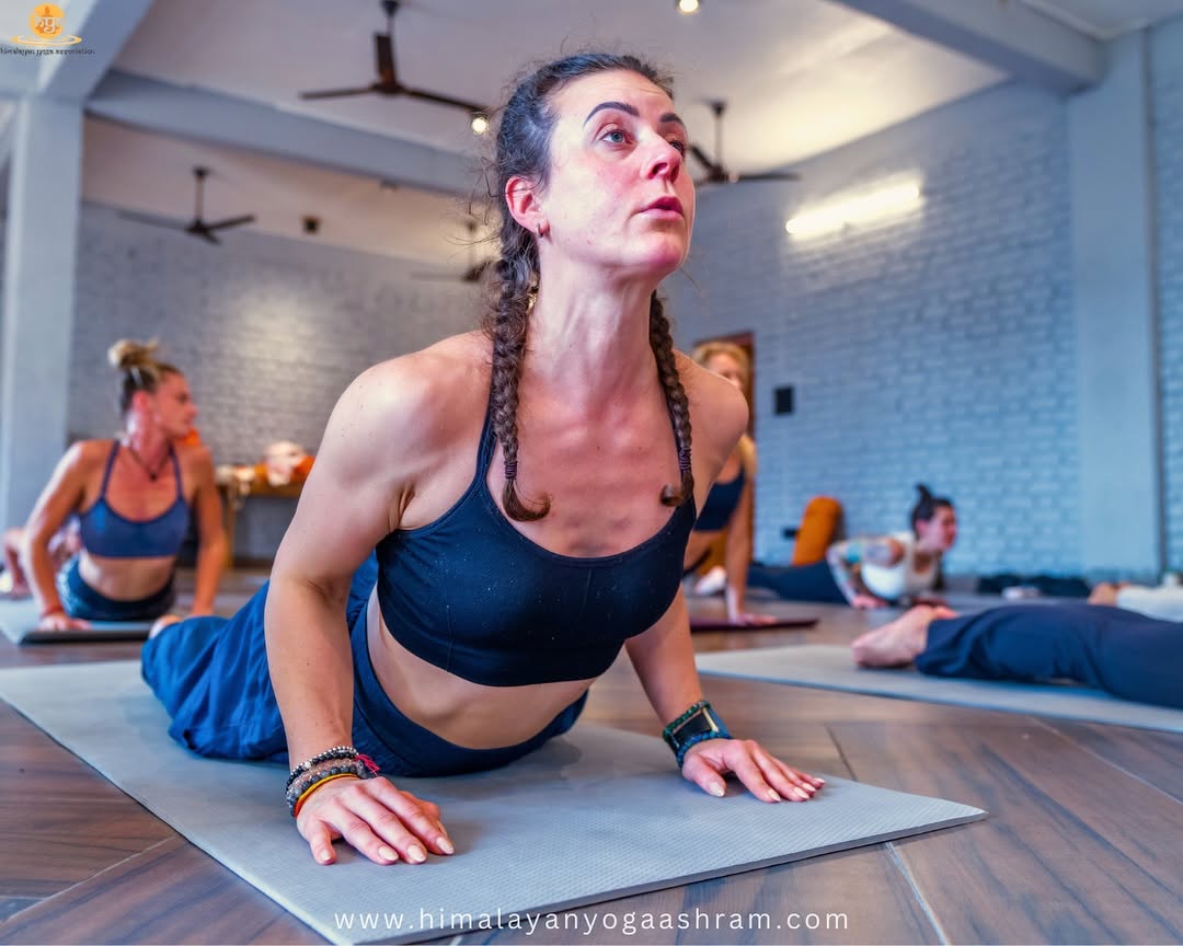 Student practising yoga in the Himalayan Yoga Ashram hall